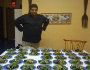 Chef Del appreciates the makings of meals for many visitors at Wellness Forum Foods