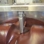 To get the chocolate smoother and thoroughly blend it with sugar, another grinder processes it for three days